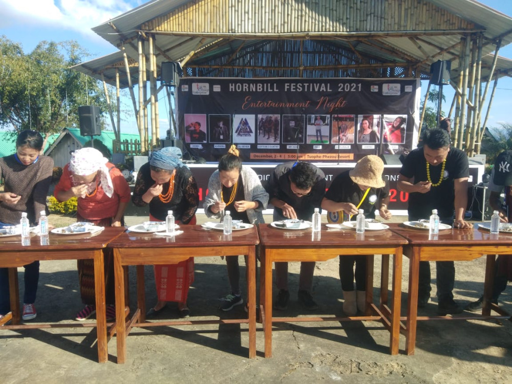 21 participants compete in snail eating to finish off 44 snails in two minutes. Dziesebeizo was declared as the winner. (Morung Photo)
